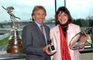 Jane receiving a BWRDC<br />Trophy from Derek Bell